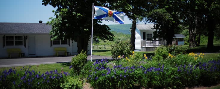 Nova Scotia flag and cabins on the property