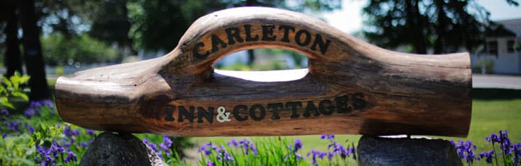 hand carved wooden Carleton Inn and Cabins sign